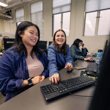 Students collaborating in the computer lab